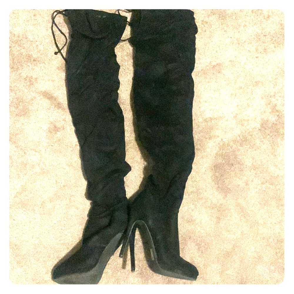 Black knee high heeled boots